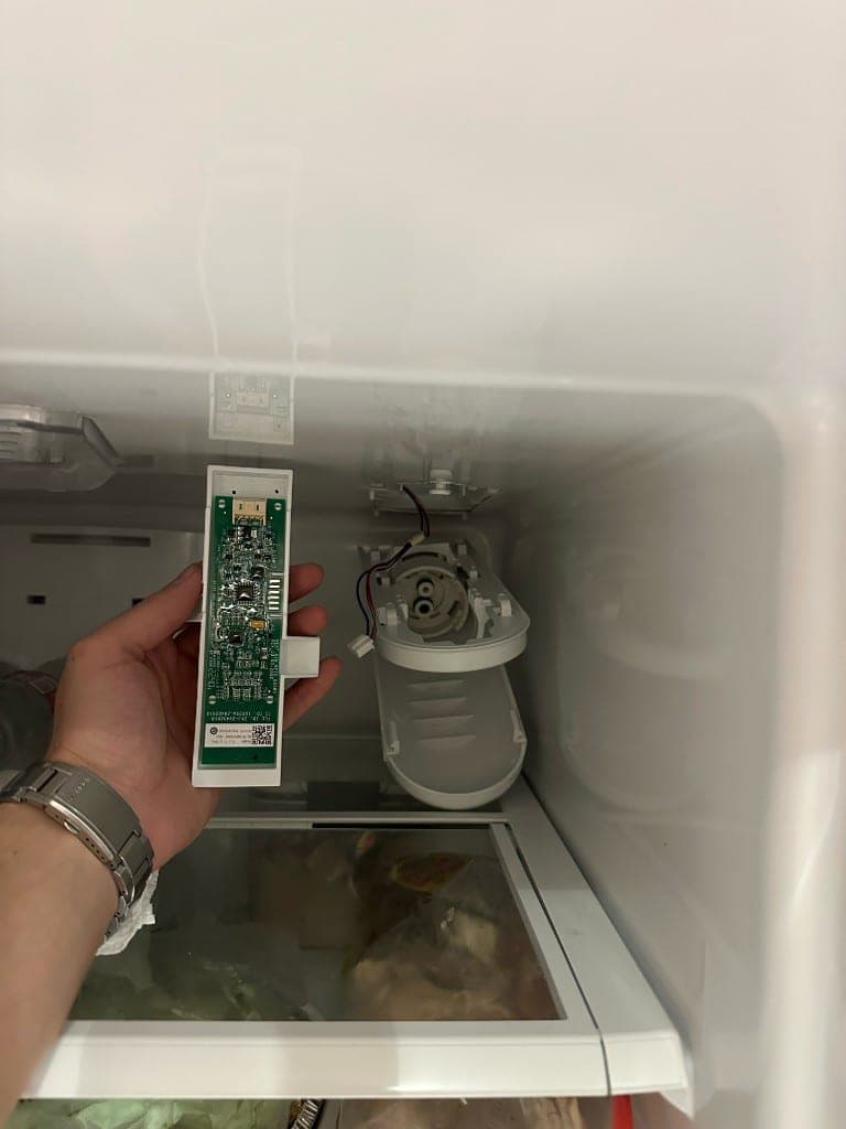 Max working on a refrigerator